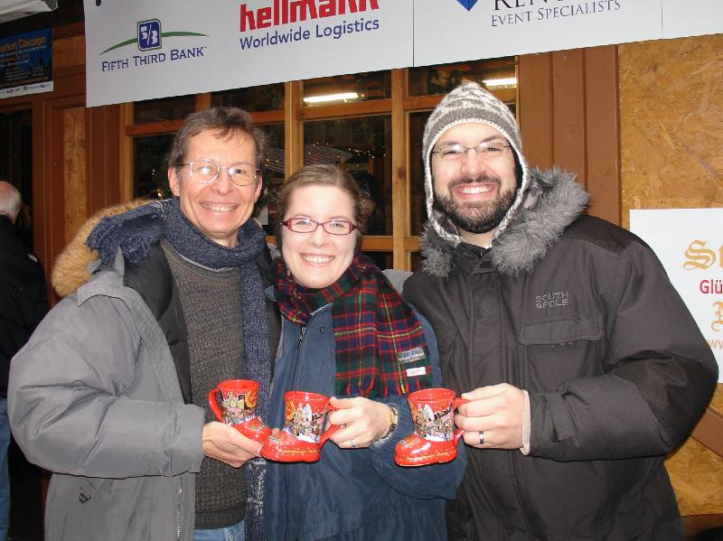20101211123114A.jpg -   Back at the market - Andrij, Natalie, and Jay, with our Glühwein mugs  